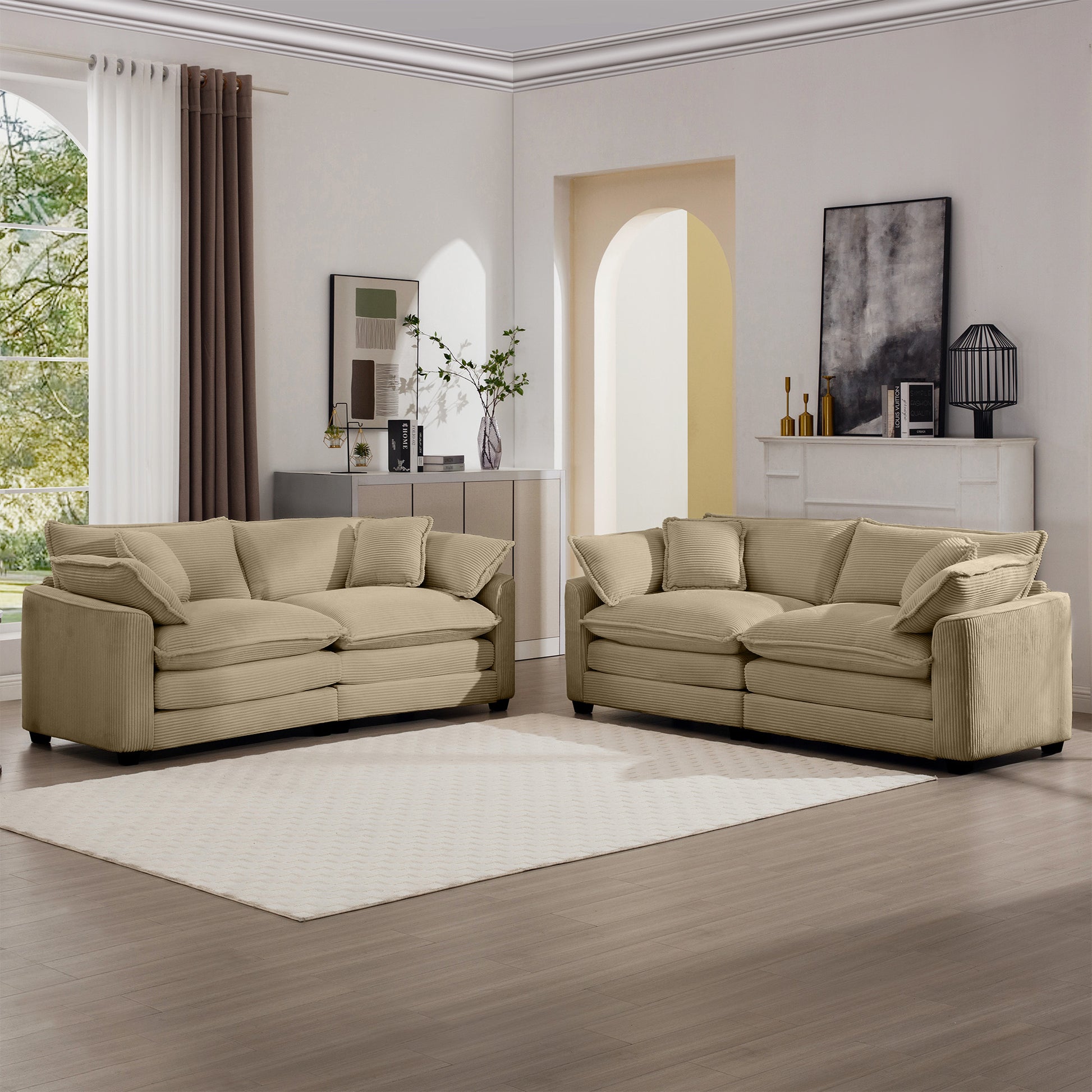 Two plush beige corduroy sofas arranged in a living room setting