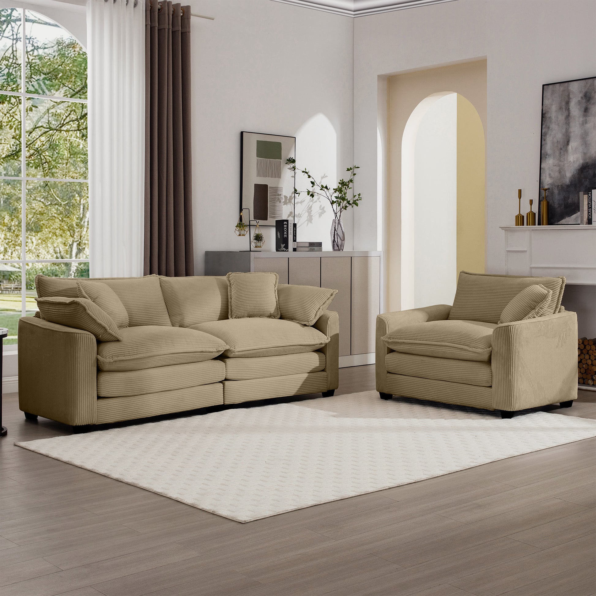 Tan corduroy sofa and armchair set with plush cushions on a white rug