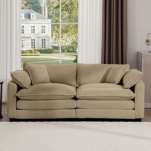 Beige corduroy sofa with plush cushions and decorative pillows perfect for a living room