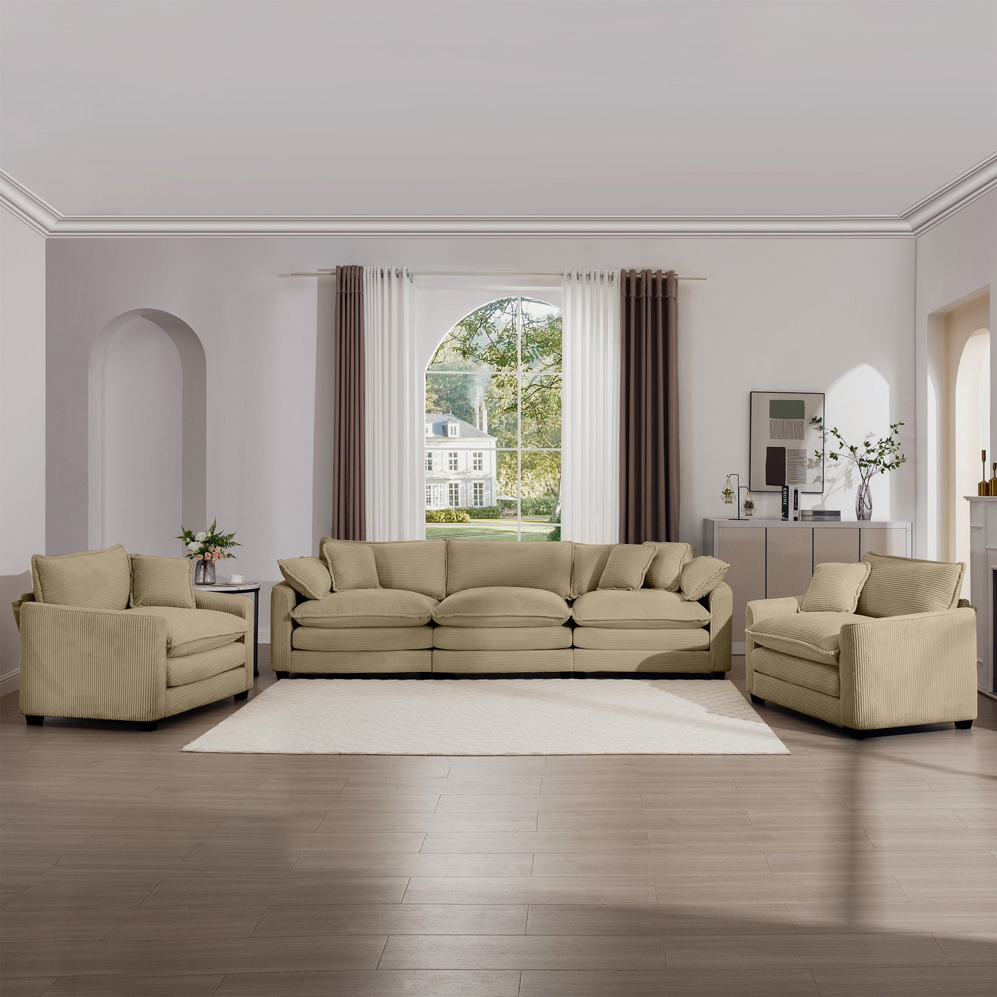 Beige corduroy sectional sofa with plush cushions and matching armchairs offering a cozy living room setup