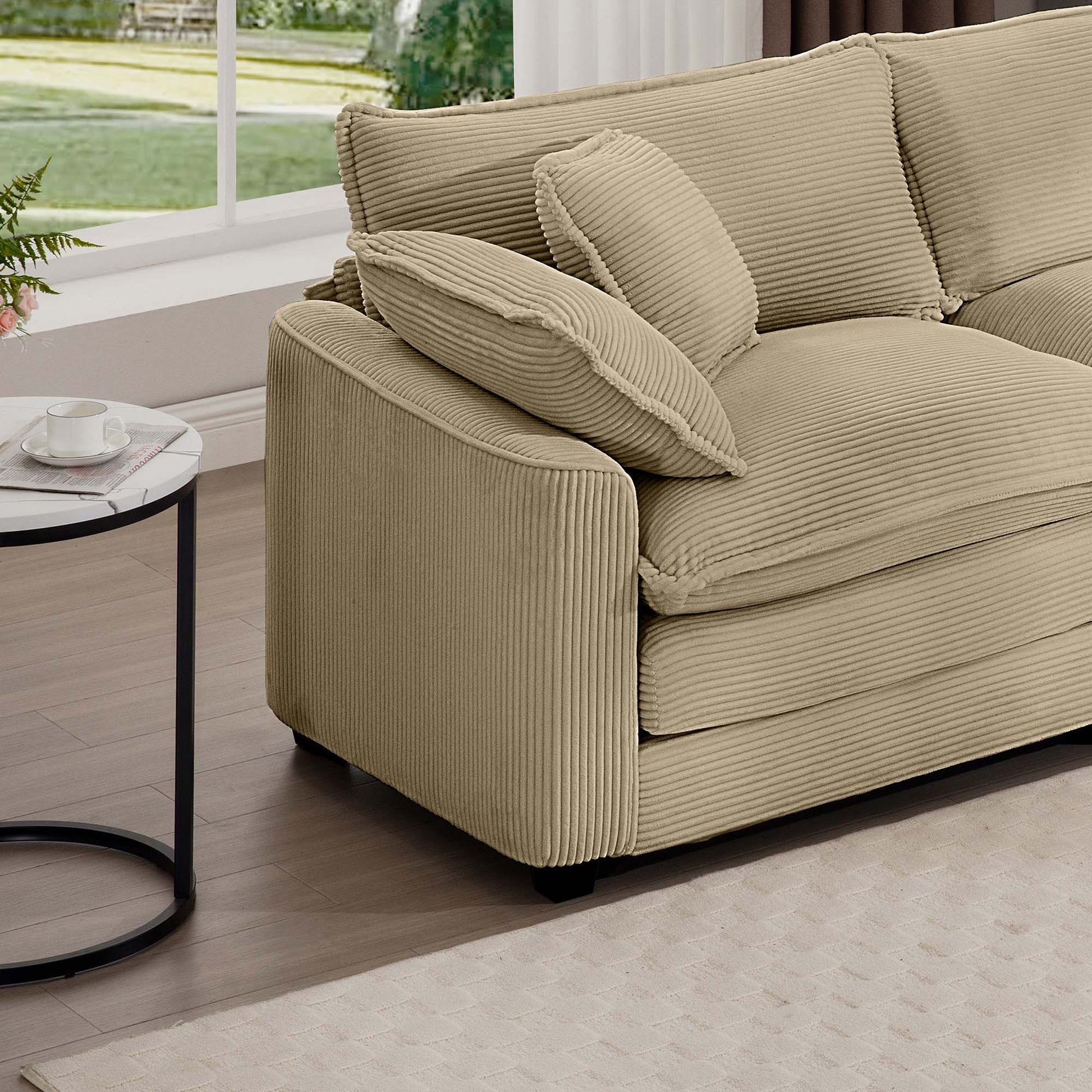 Beige corduroy sectional sofa with plush cushions and armrests for ultimate comfort