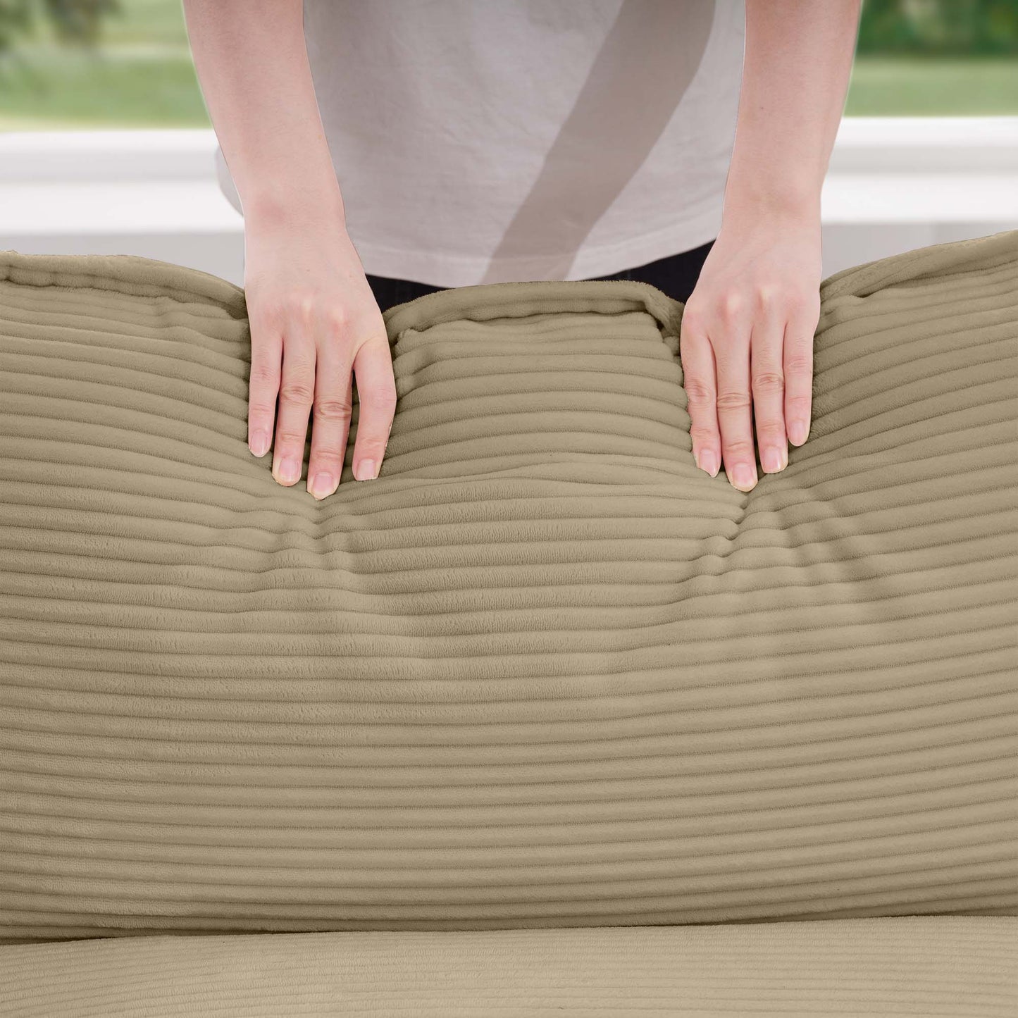 Plush corduroy fabric in beige showing a soft textured surface with horizontal ribs