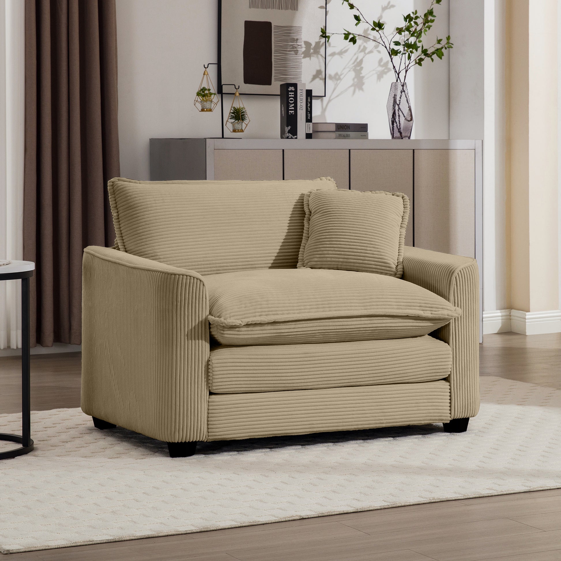 Comfortable beige corduroy accent chair with plush cushions perfect for any living room