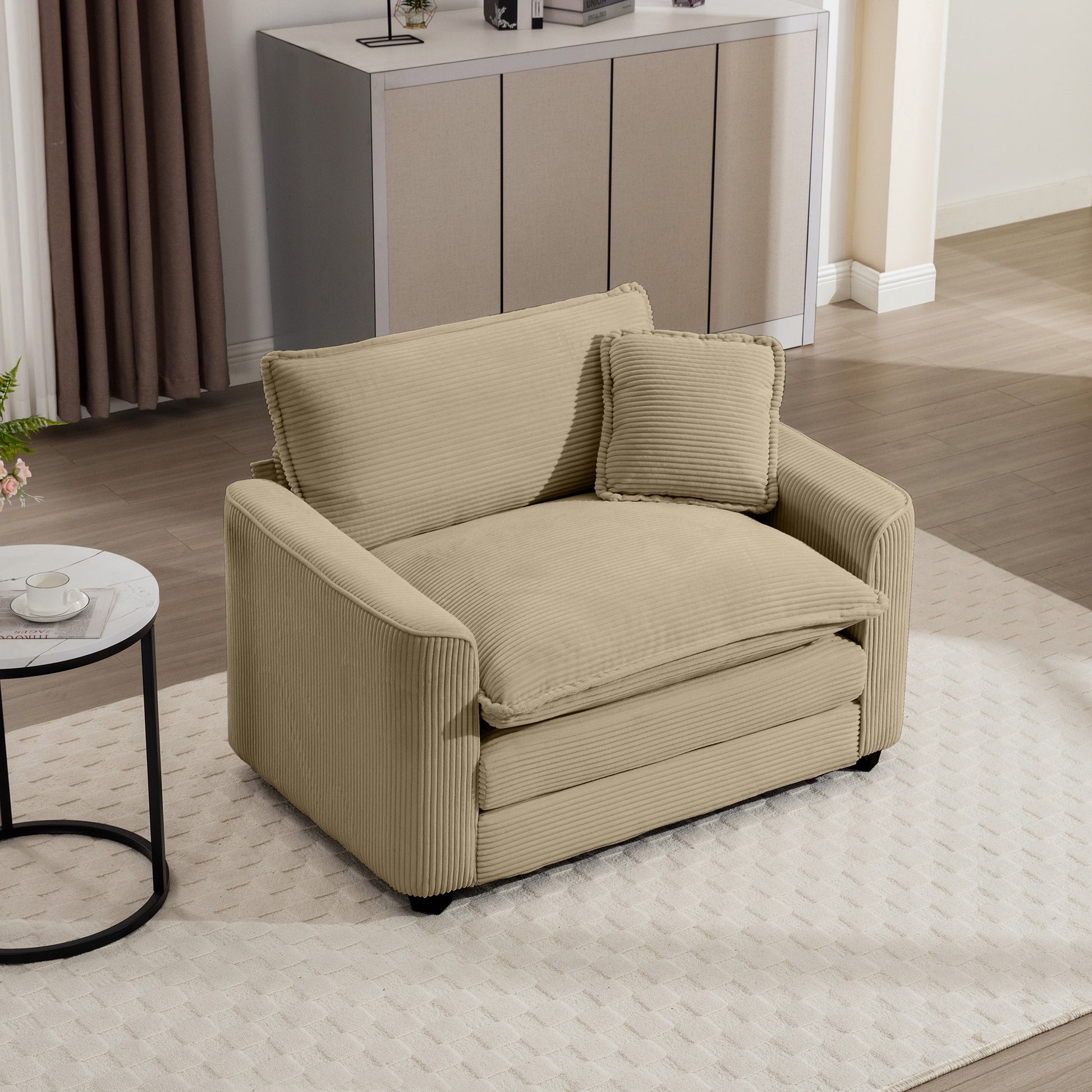 Beige corduroy armchair with deep seating and plush throw pillow
