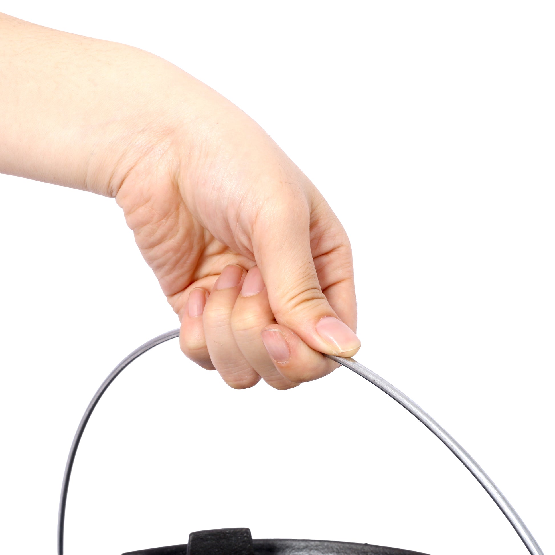 Closeup of hand holding a silver metal bucket handle ready for carrying