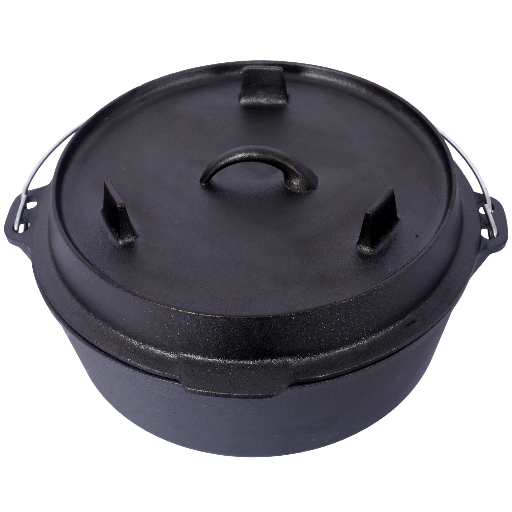 Black cast iron Dutch oven with a lid and wire handle for campfire cooking