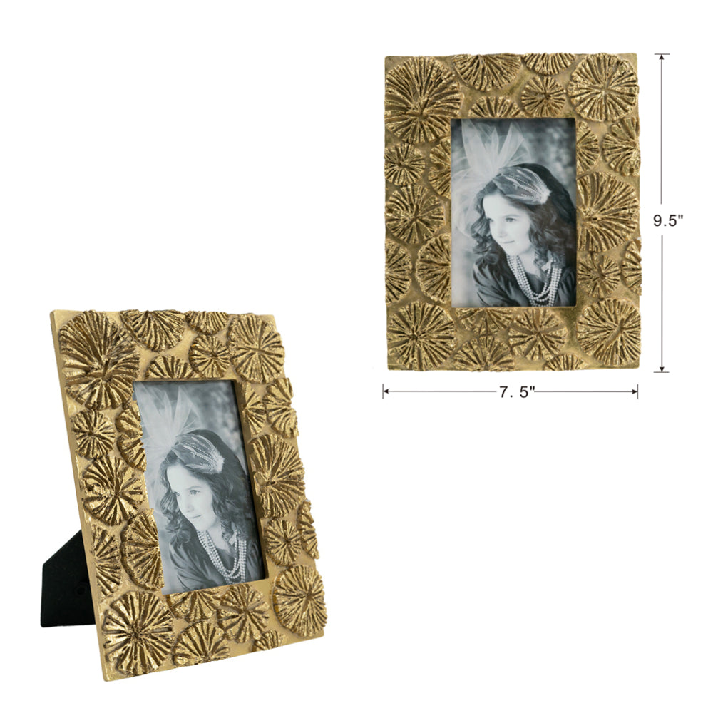 Ornate gold picture frame with floral motif displaying a portrait of a young girl
