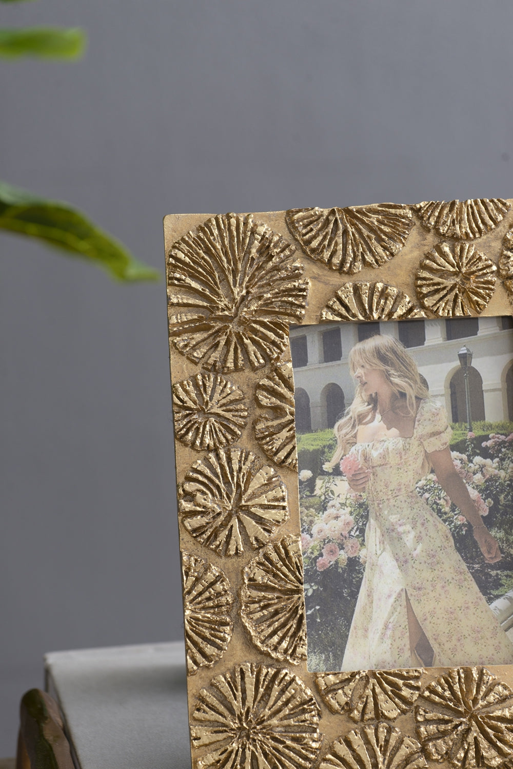 Gold ornate photo frame with embossed floral pattern elegant home decor