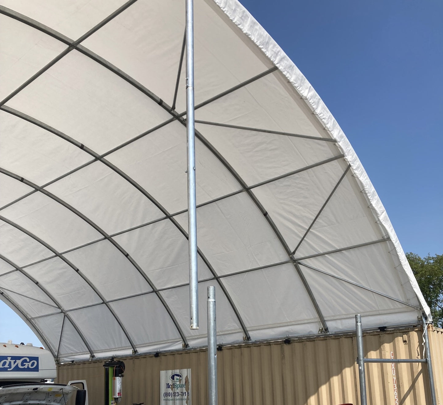 White portable canopy shelter with metal frame ideal for outdoor events