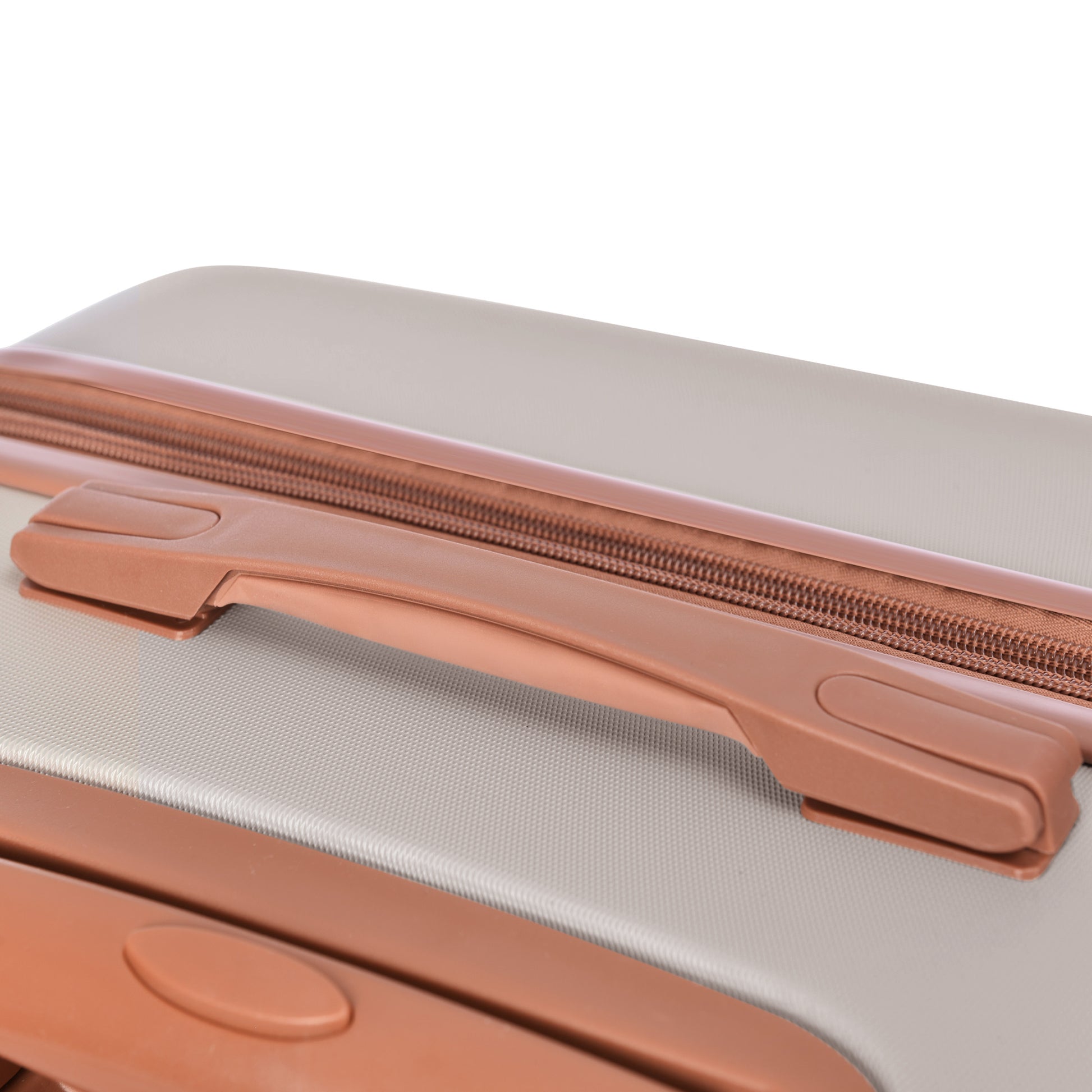 Close up of a grey suitcase with a brown zipper and handle