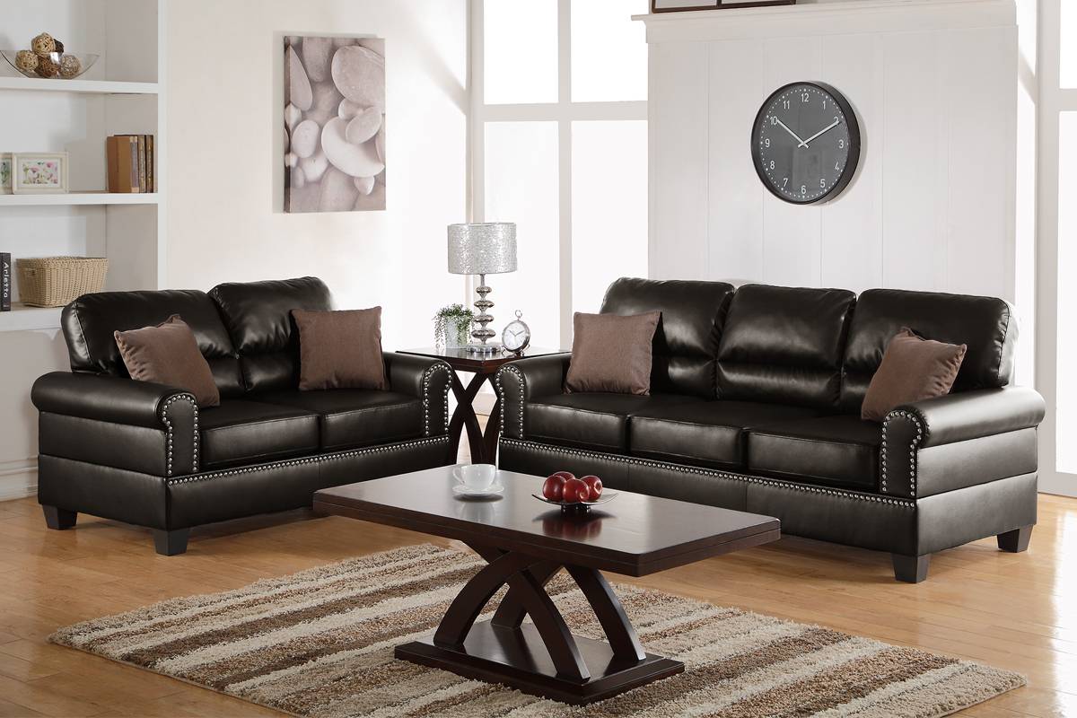 Dark brown bonded leather sofa with silver nailhead trim accents