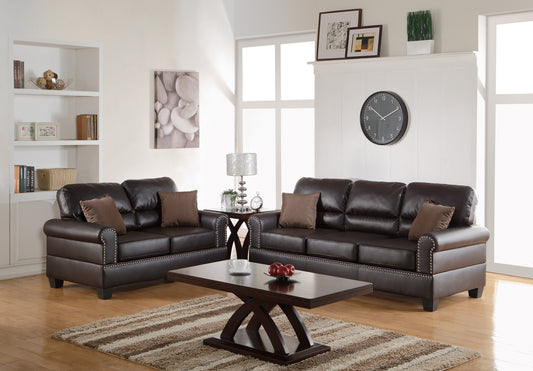 Luxurious dark brown leather sofa set with studded accents and comfortable throw pillows
