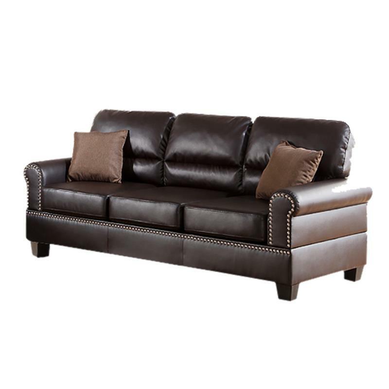 Dark brown leather sofa with nailhead trim and two accent pillows