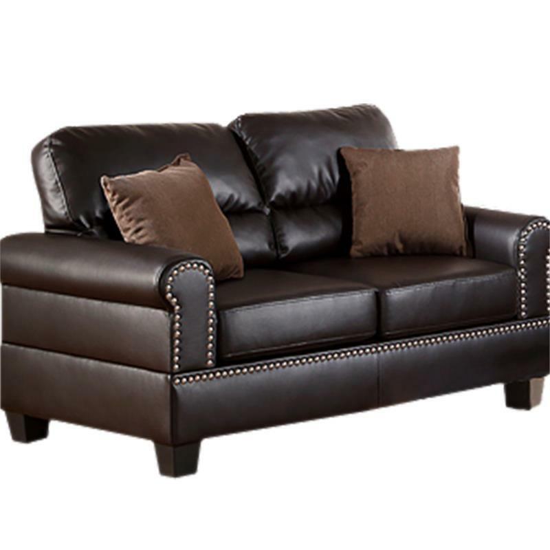 Dark brown faux leather loveseat with studded arms and two brown accent pillows