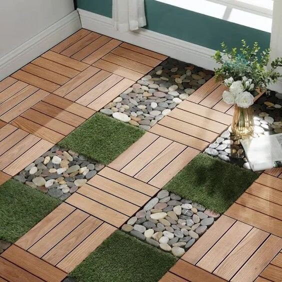 Natural wood deck tiles with integrated stone and artificial grass for a garden patio