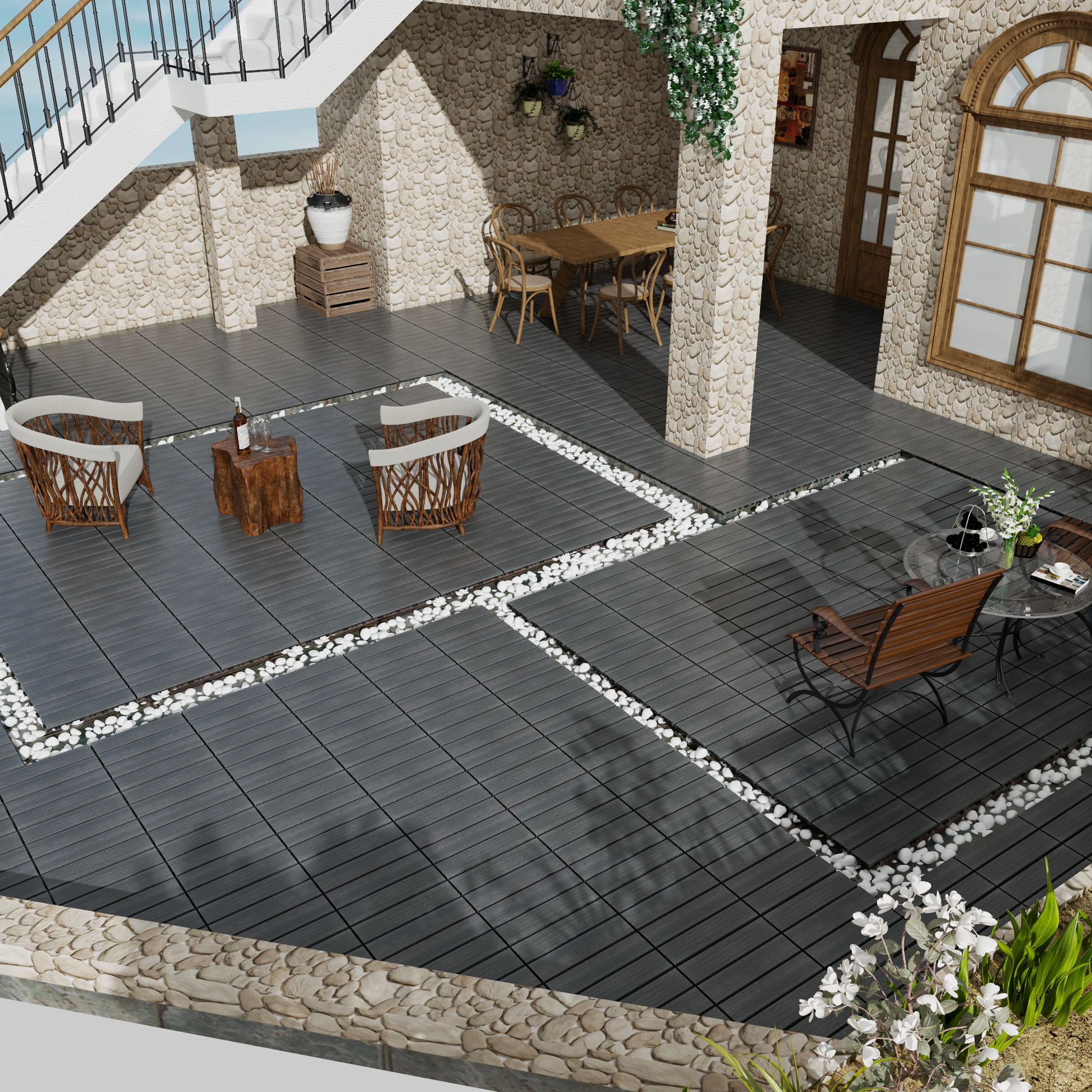 Dark grey composite decking tiles with white pebble accents for an outdoor patio