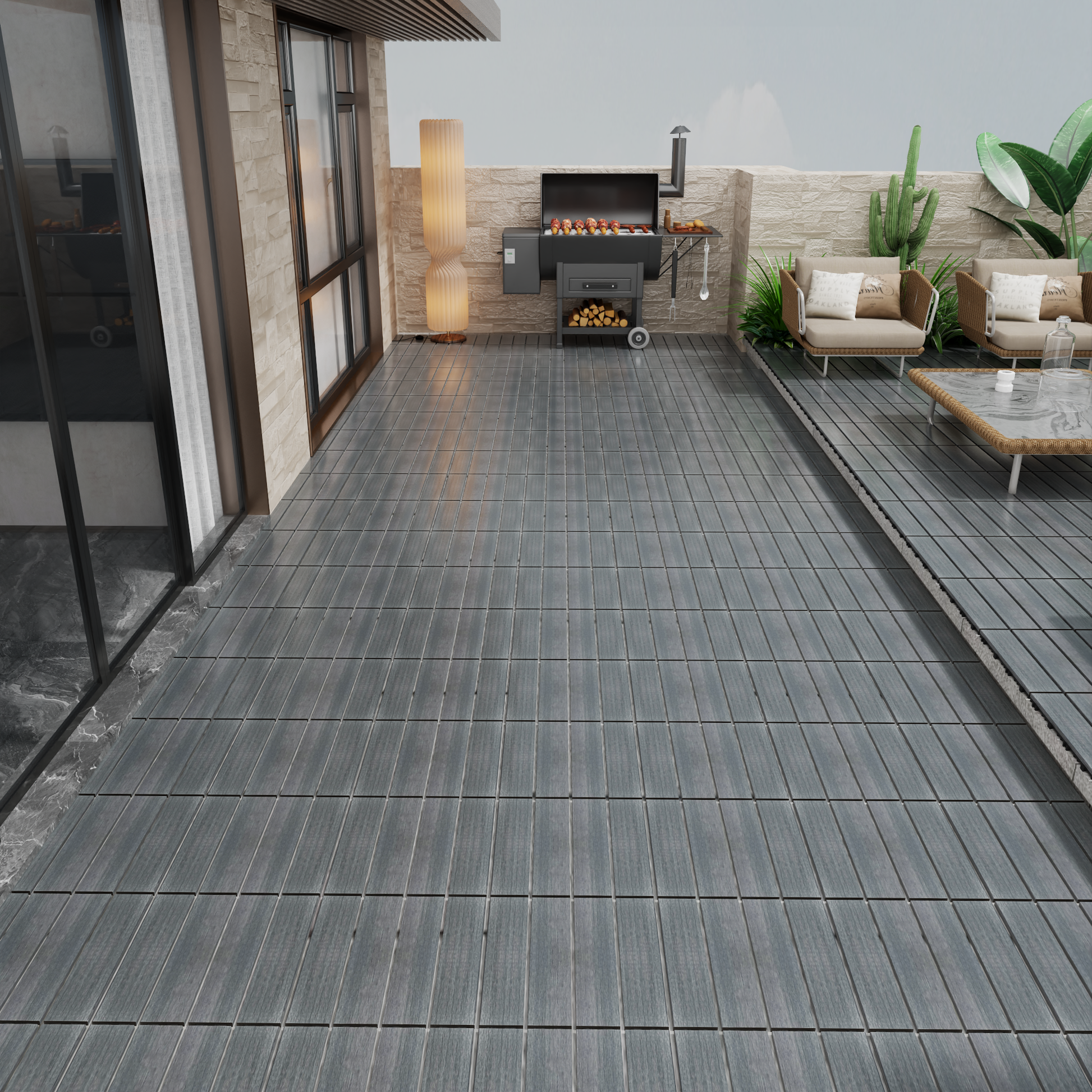 Dark grey composite decking tiles with a wood grain texture for outdoor patios