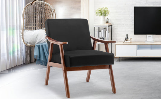 Modern accent chair with plush black upholstery and natural wood frame Comfortable armchair for reading nooks