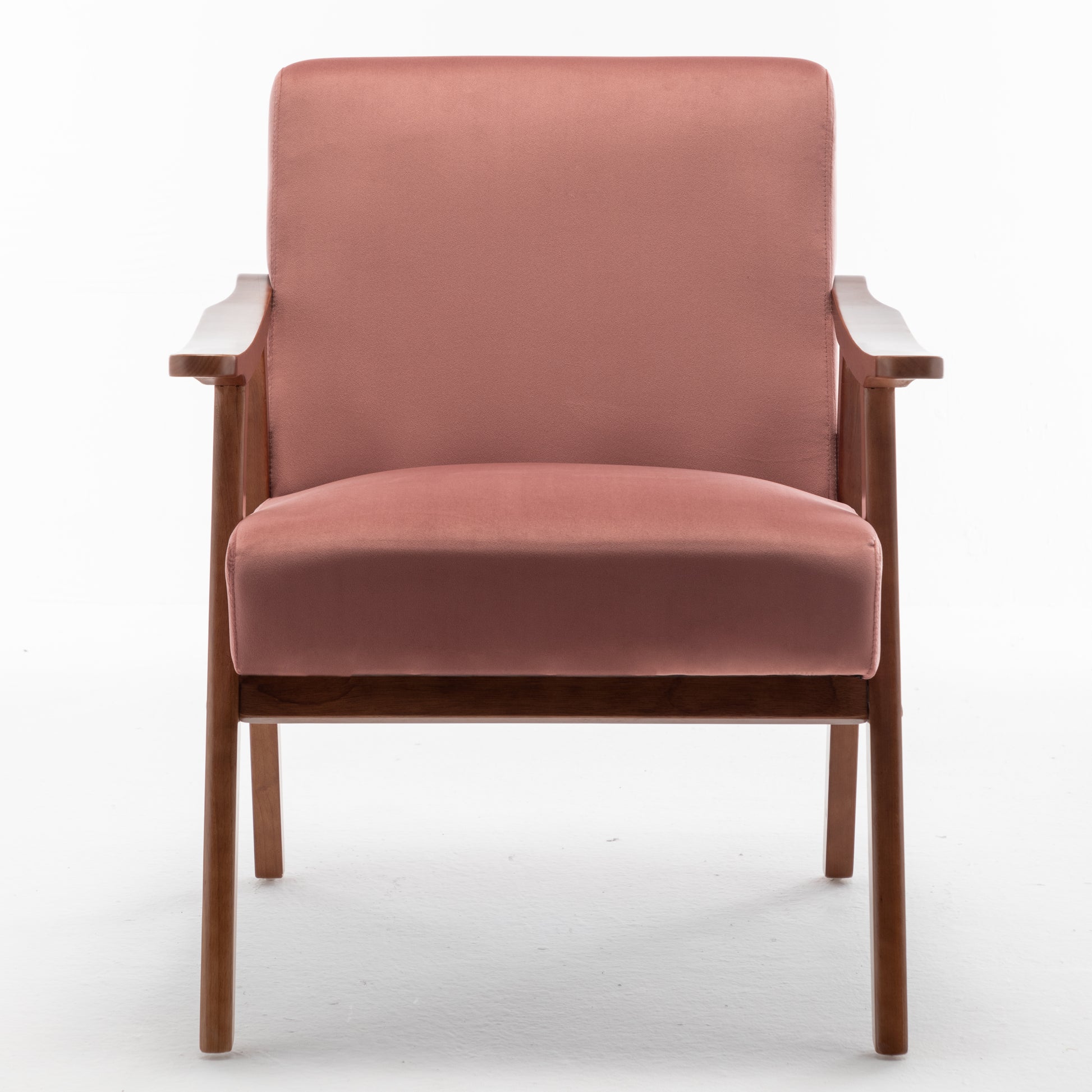 Dusty rose velvet armchair with solid wood frame and tapered legs