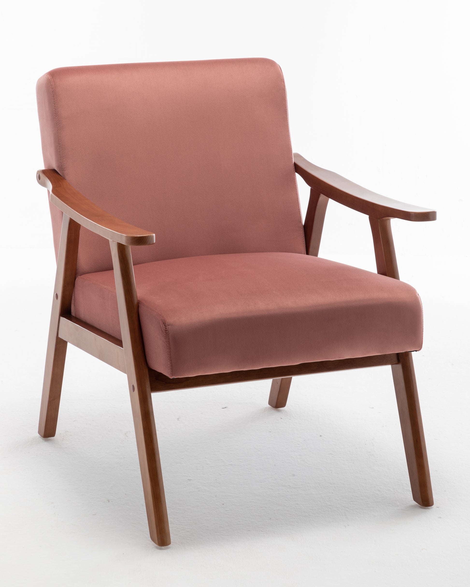 Dusty rose velvet armchair with wooden frame and armrests for comfortable seating