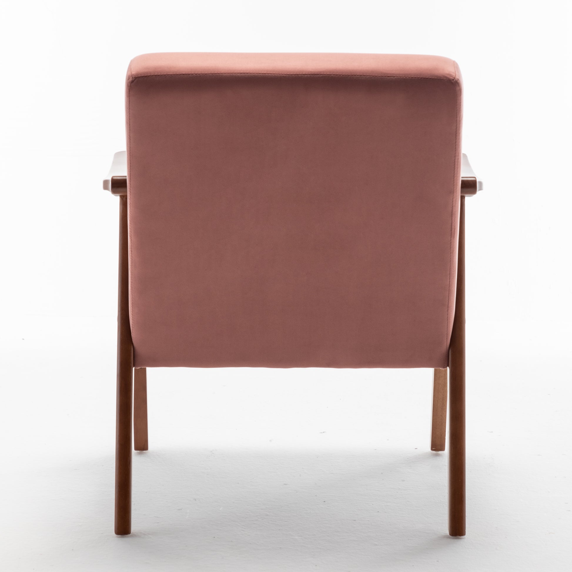 Rose velvet armchair with minimalist wooden frame perfect for a modern living room