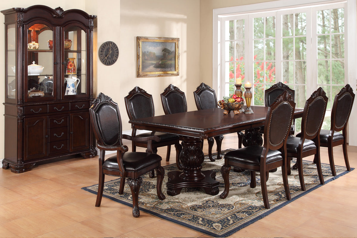 Dark wood dining table with ornate carved base and eight leather upholstered chairs
