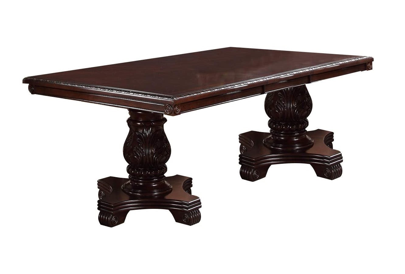 Ornate dark wood dining table with carved pedestal legs perfect for formal dining rooms