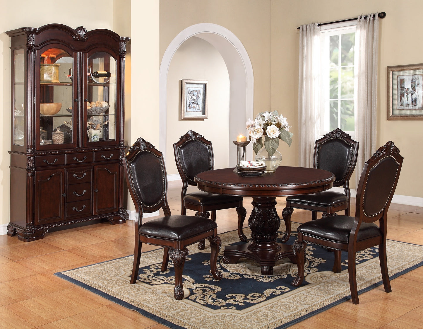 Ornate dark wood china cabinet with glass doors and display shelves showcasing dining essentials