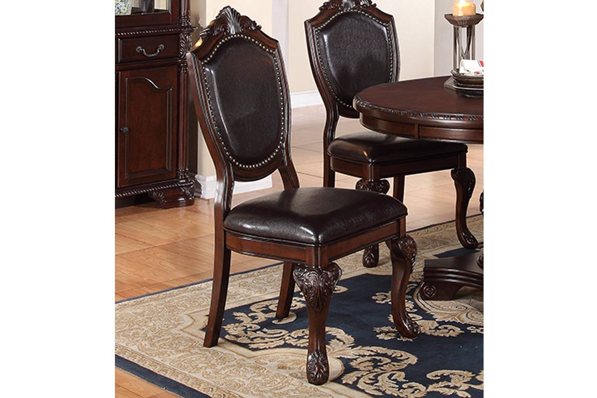 Ornate dark brown leather dining chair with carved wooden legs