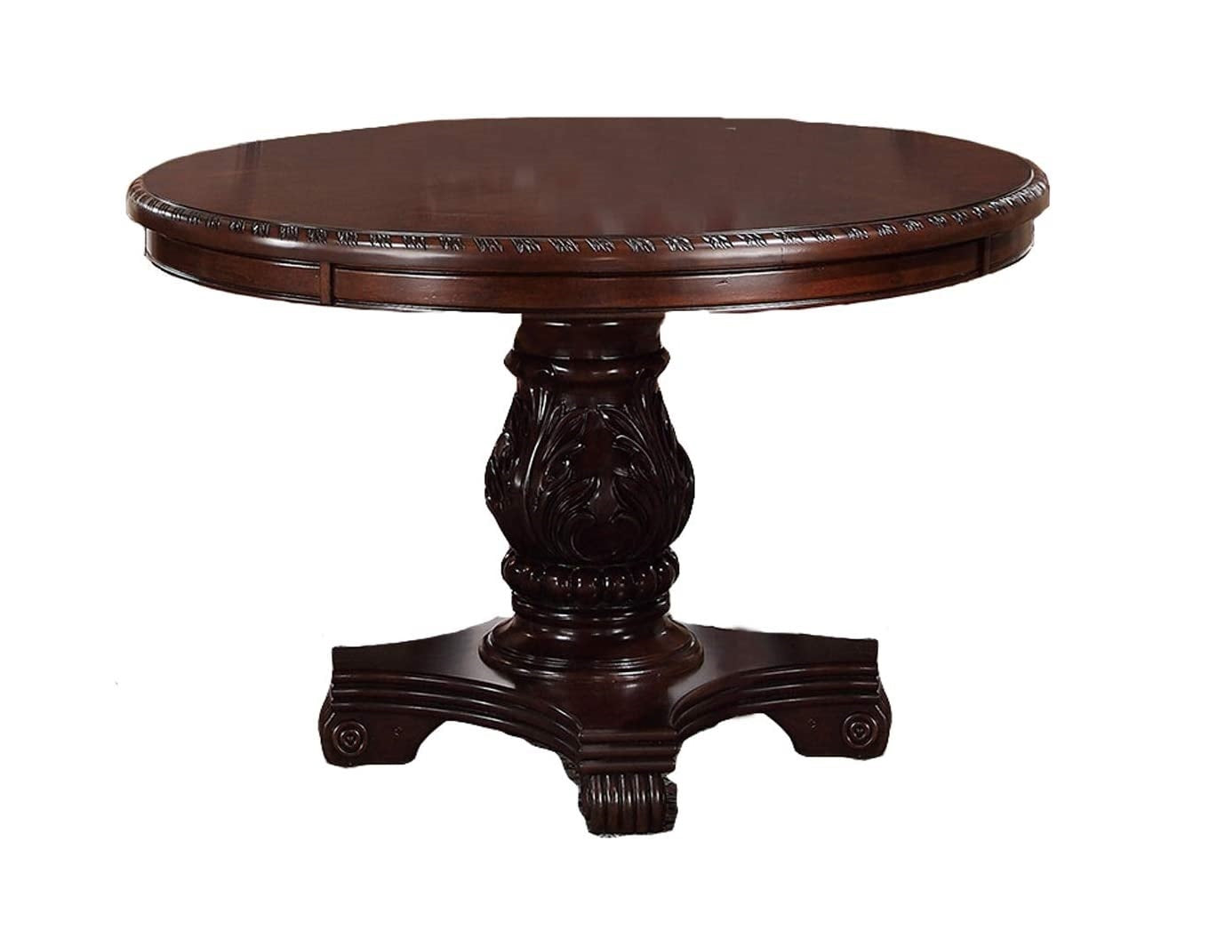 Ornate dark wood pedestal dining table with carved base and decorative edge