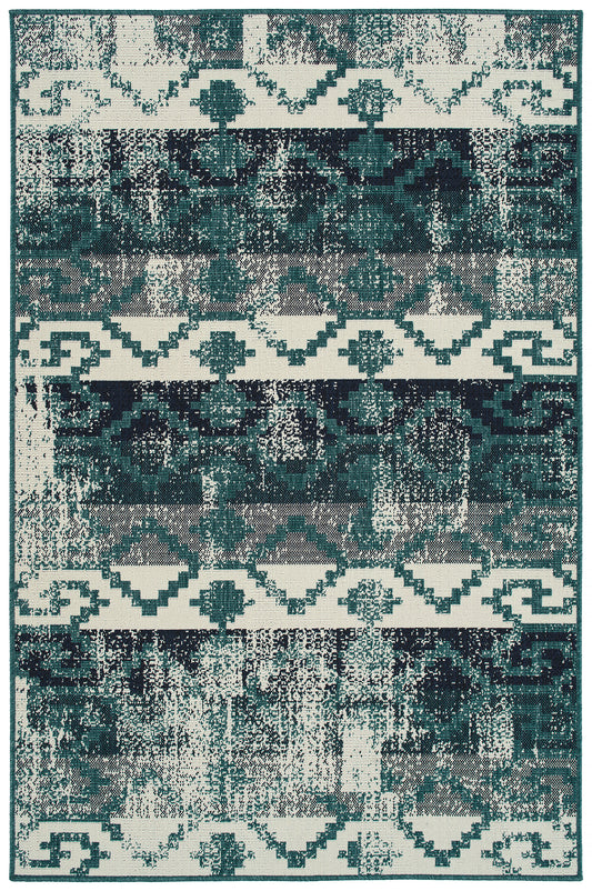 Dark teal and cream distressed abstract tribal pattern rug