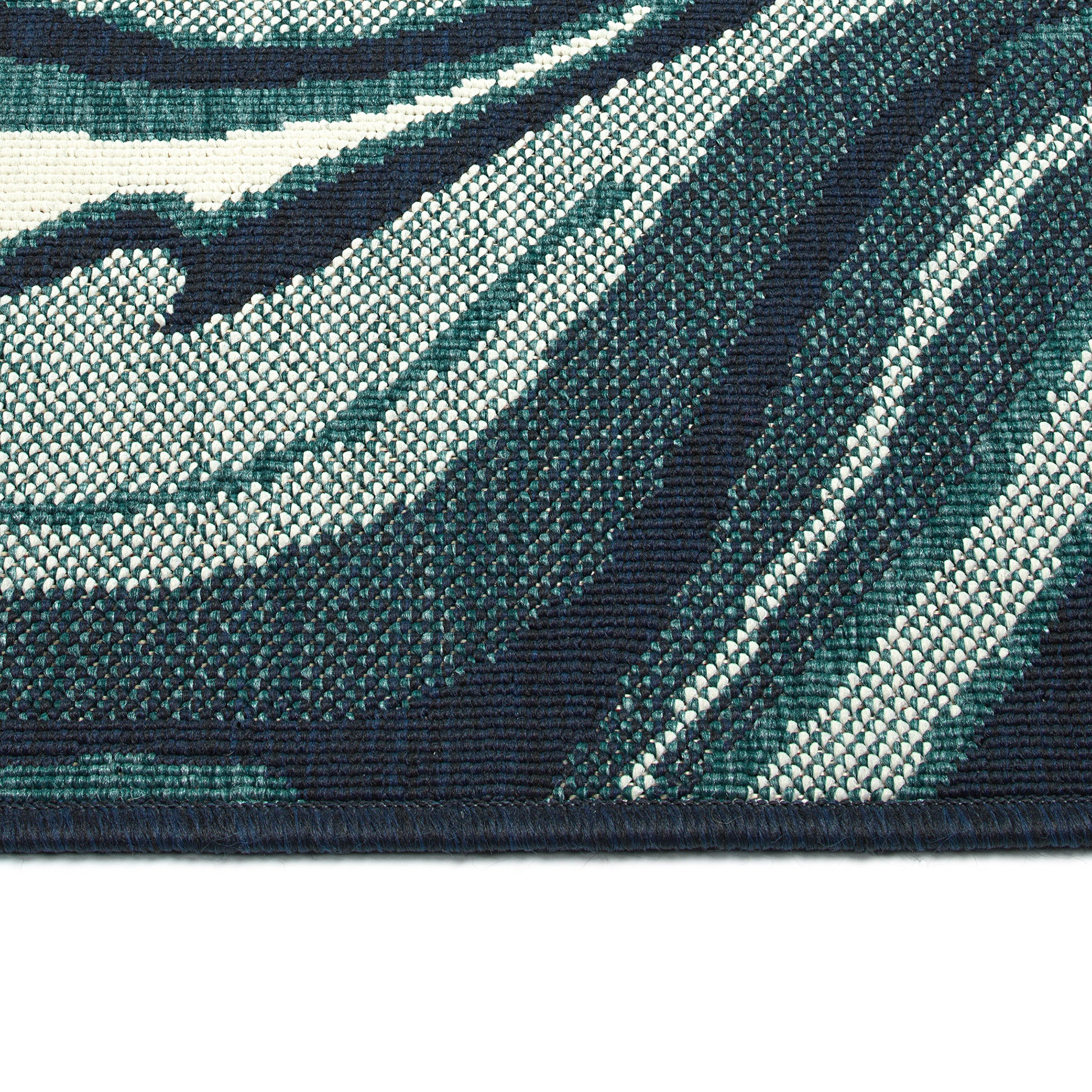 Closeup textured view of a blue and white abstract striped area rug
