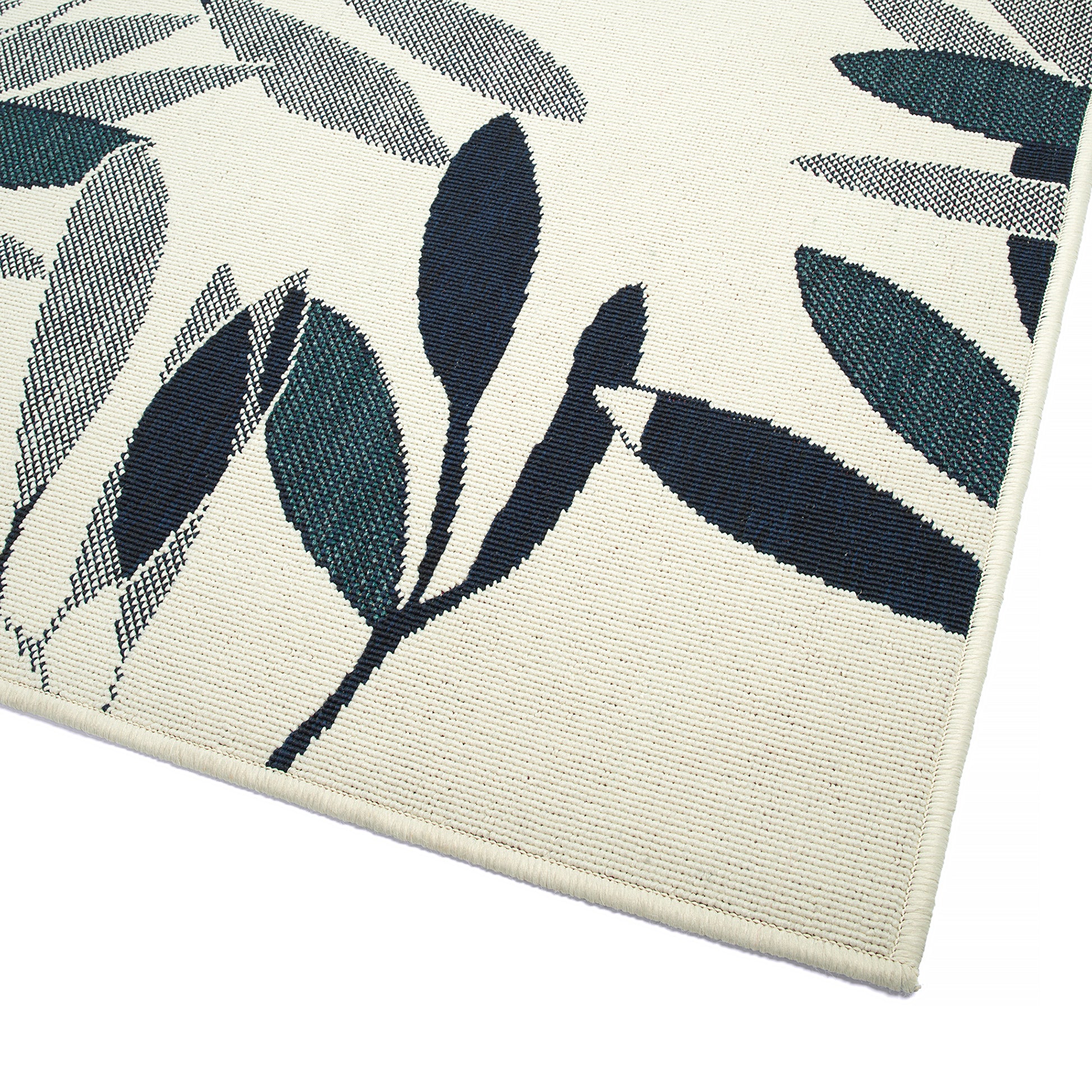 Cream rug with navy and teal abstract leaf pattern