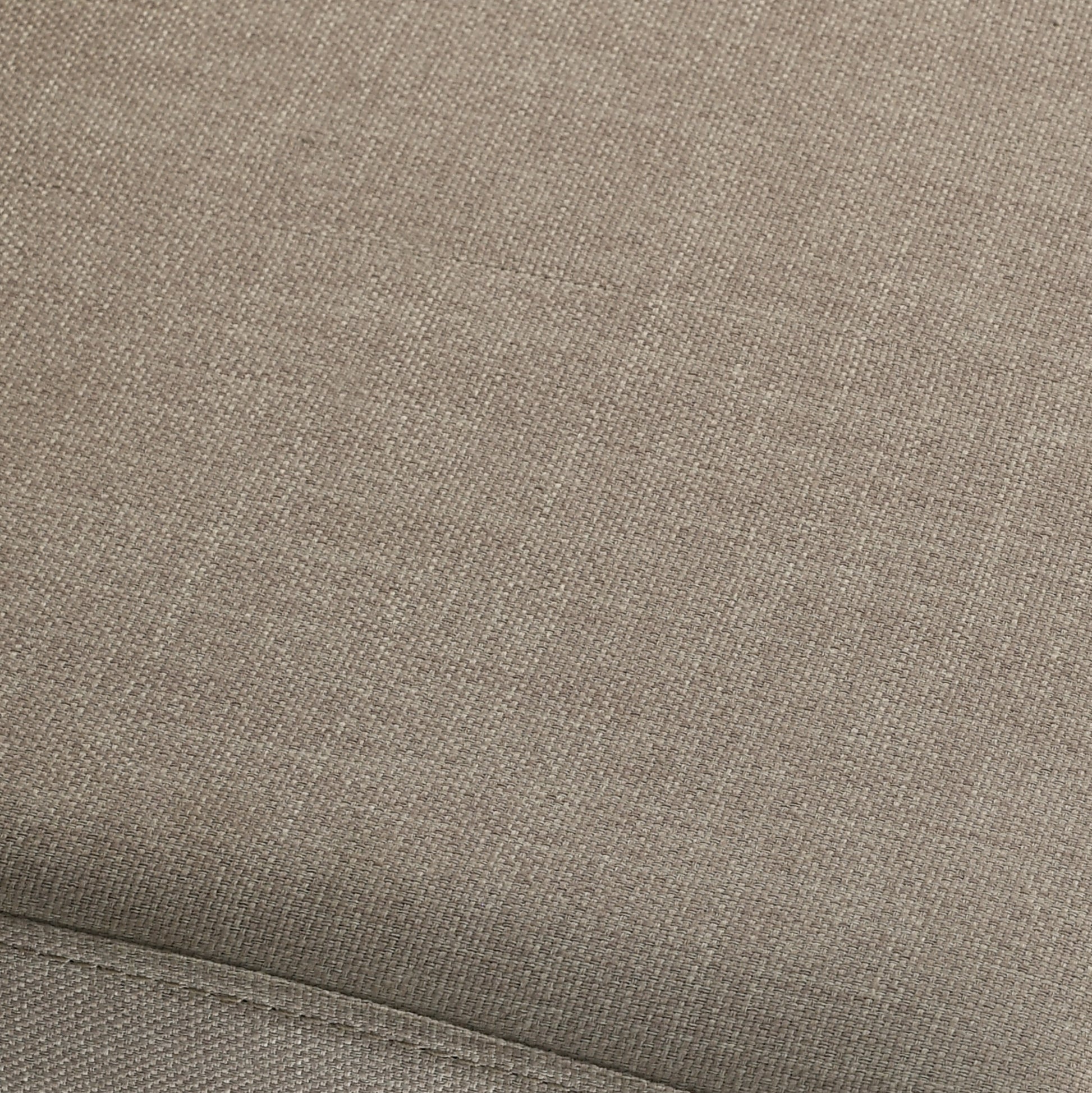 Closeup of textured taupe woven upholstery fabric