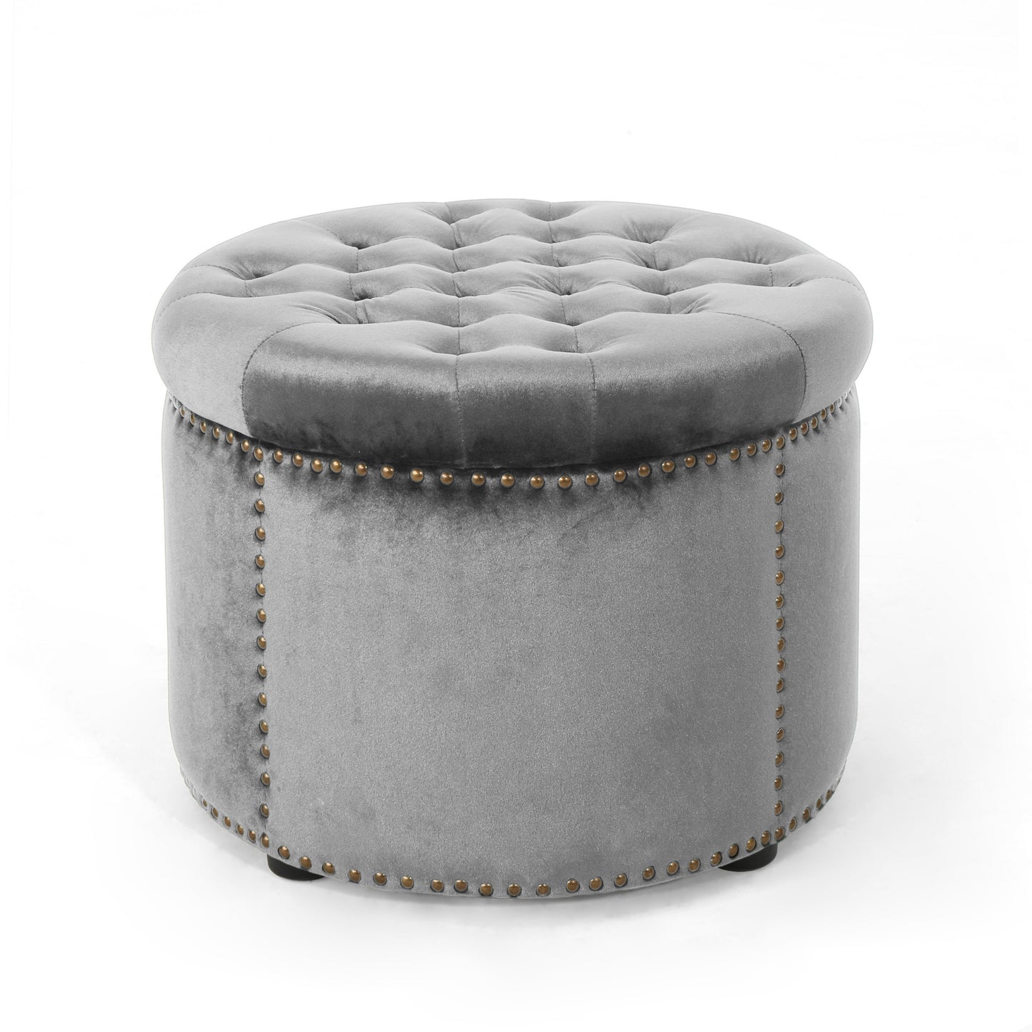 Tufted grey velvet ottoman with brass nailhead trim detail providing elegant seating or storage