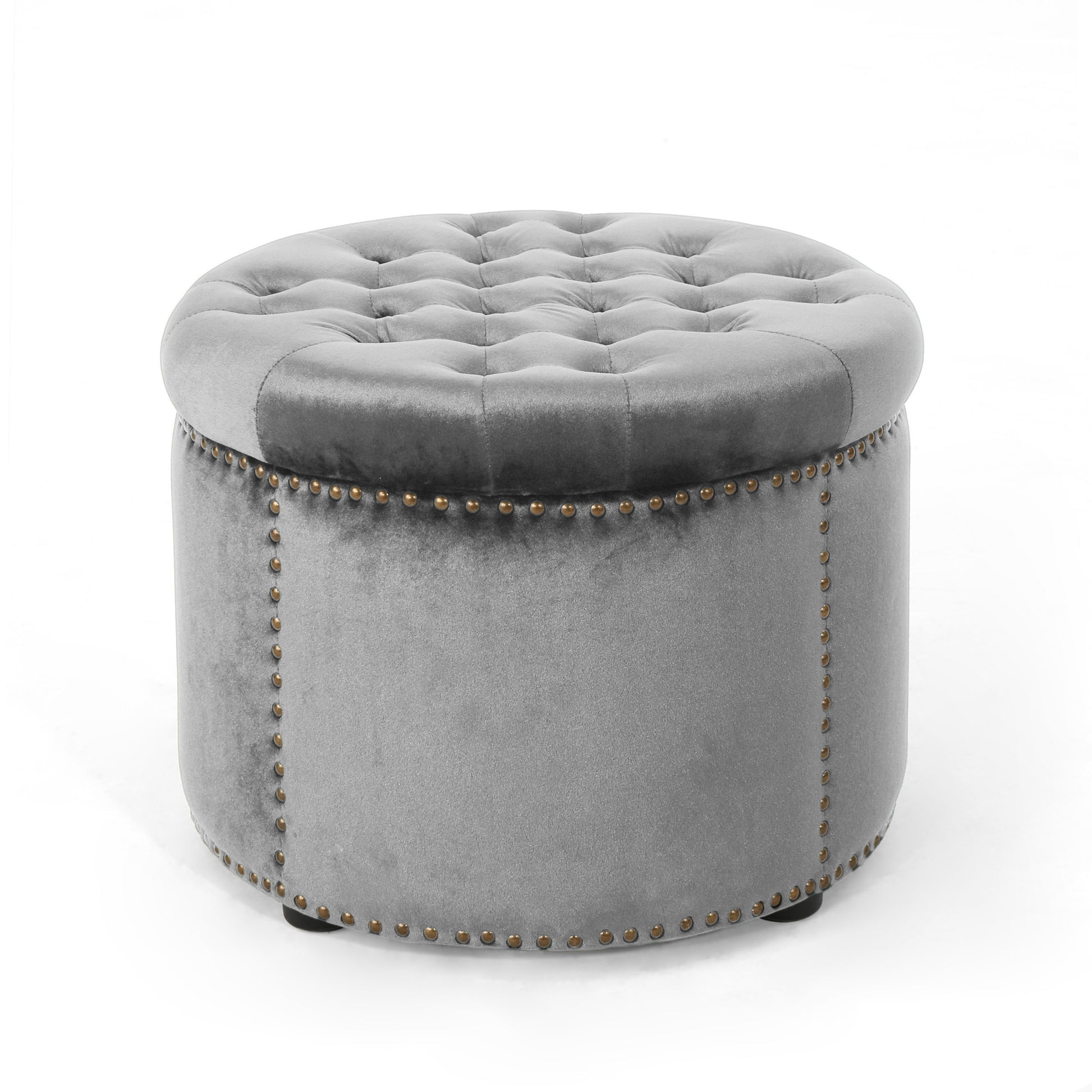 Tufted grey velvet ottoman with brass nailhead trim detail providing elegant seating or storage