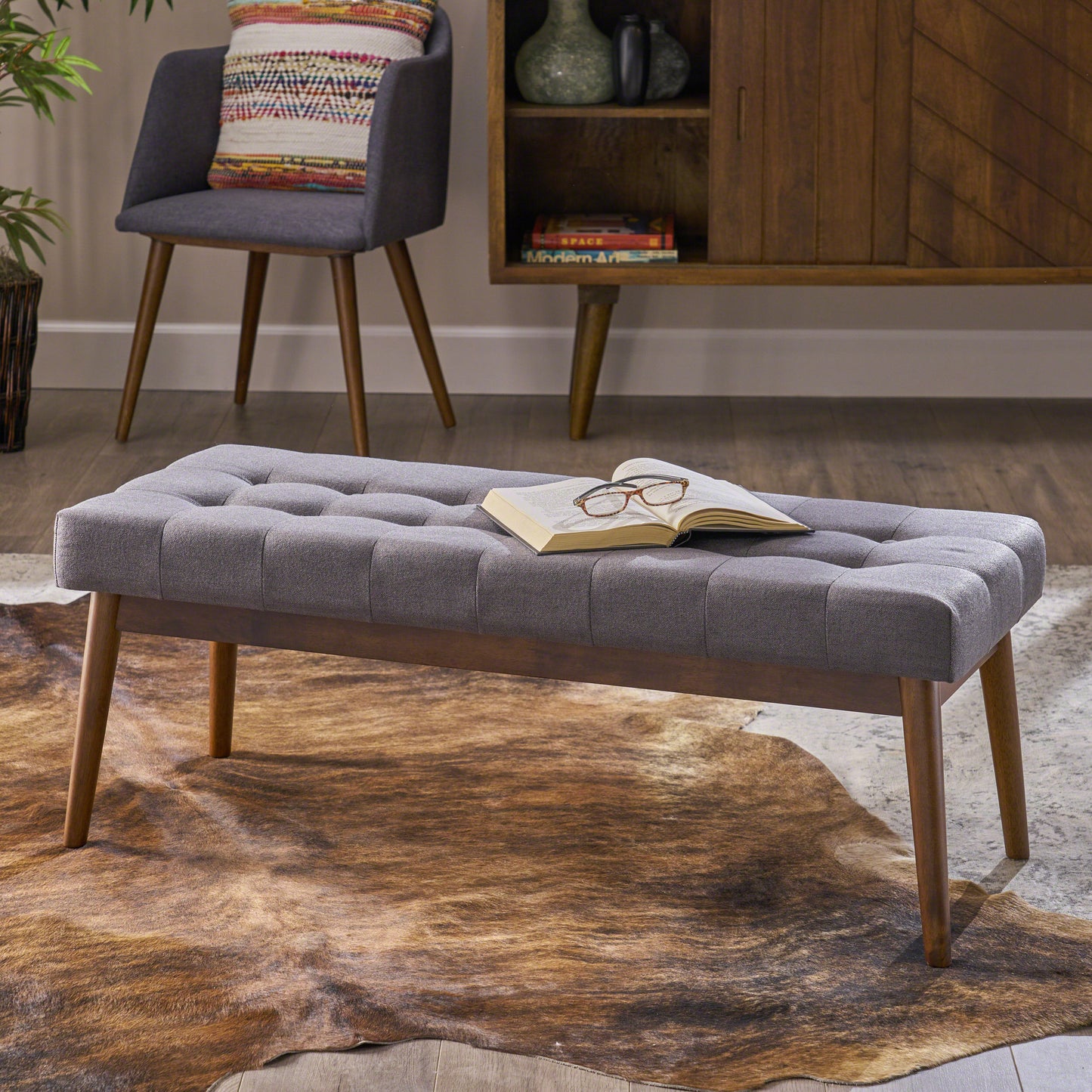 Tufted grey fabric bench with wooden legs perfect for entryway seating