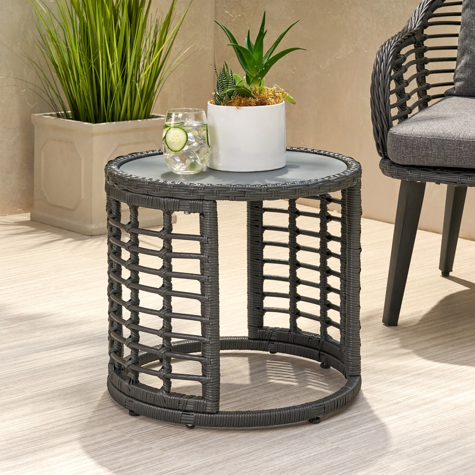 Dark gray wicker round side table with glass top perfect for outdoor patios