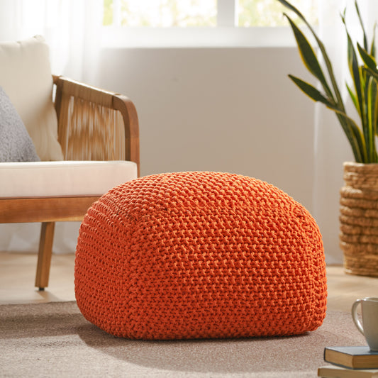 Orange knit pouf with textured yarn perfect for footrest or extra seating