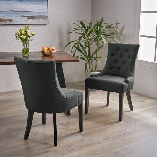 Tufted dark grey upholstered dining chair with wooden legs and a curved back for a classic look