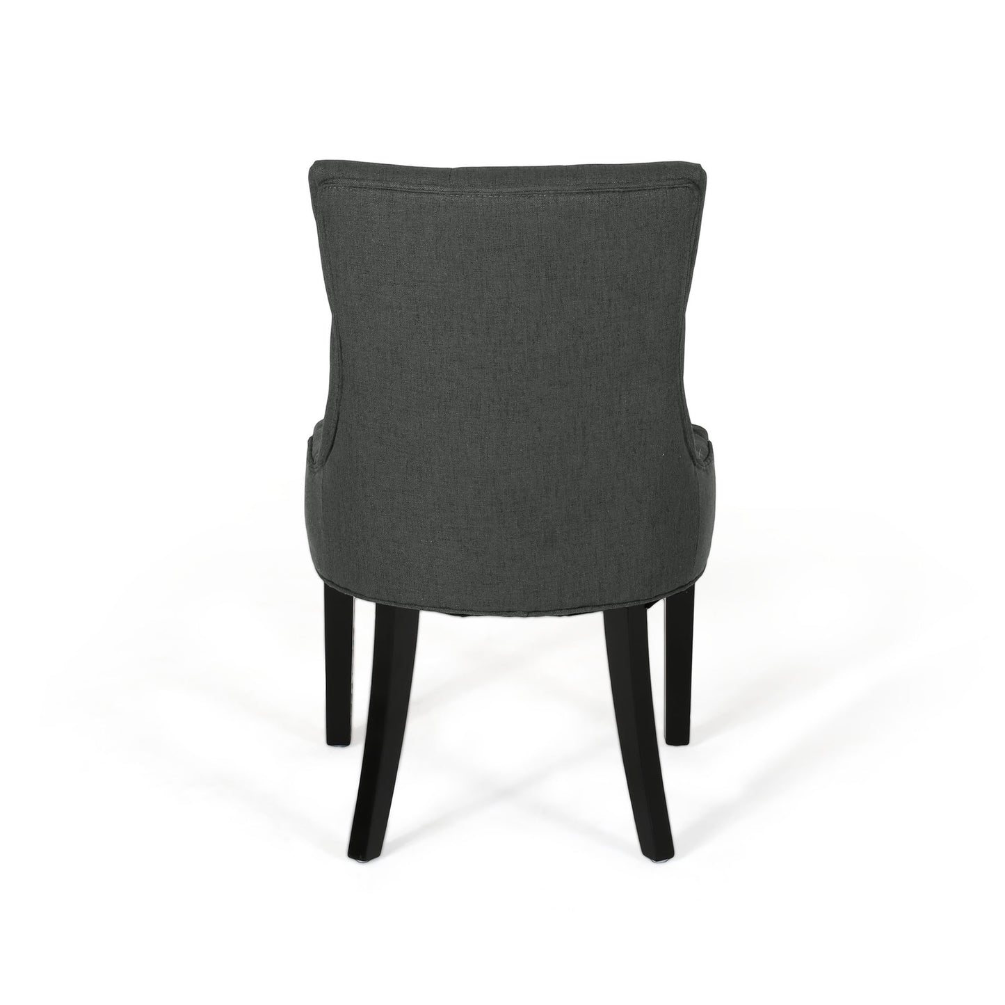 Dark gray upholstered dining chair with button tufting and black legs