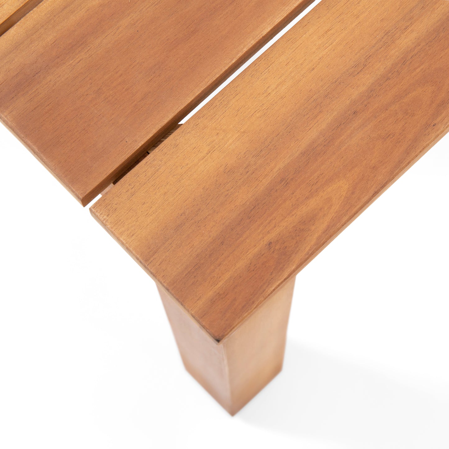 Closeup of a natural wood table surface with clean slats and a sturdy leg