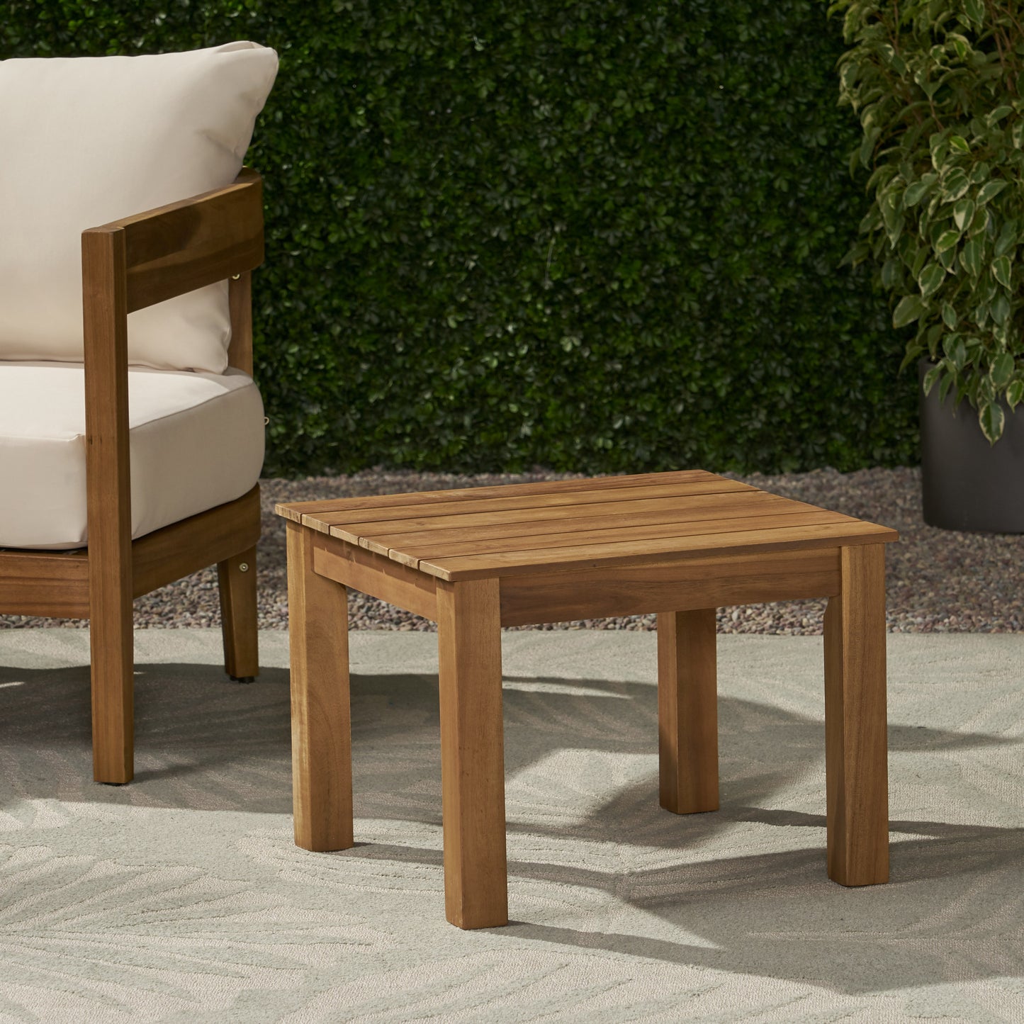Acacia wood side table with slatted top perfect for outdoor patio use