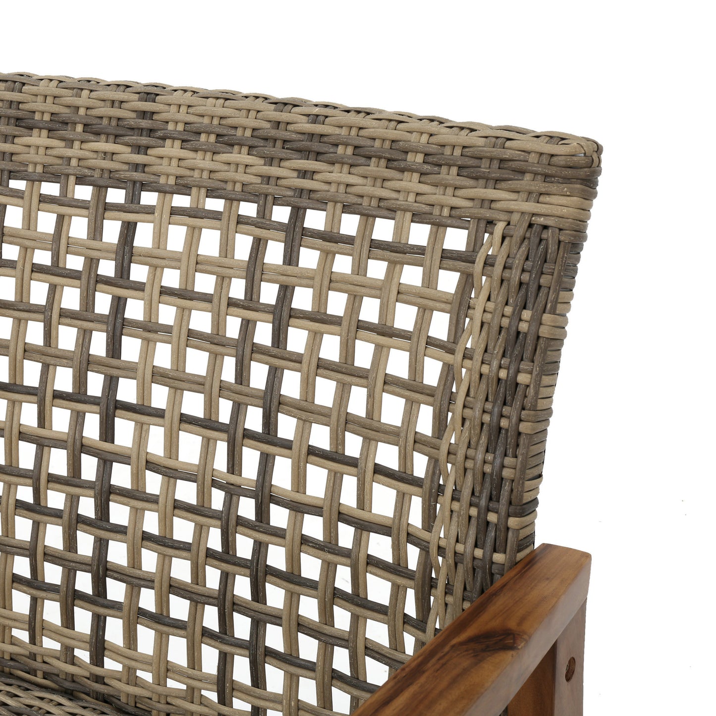 Closeup of a twotone rattan weave chair back with a wooden armrest detail