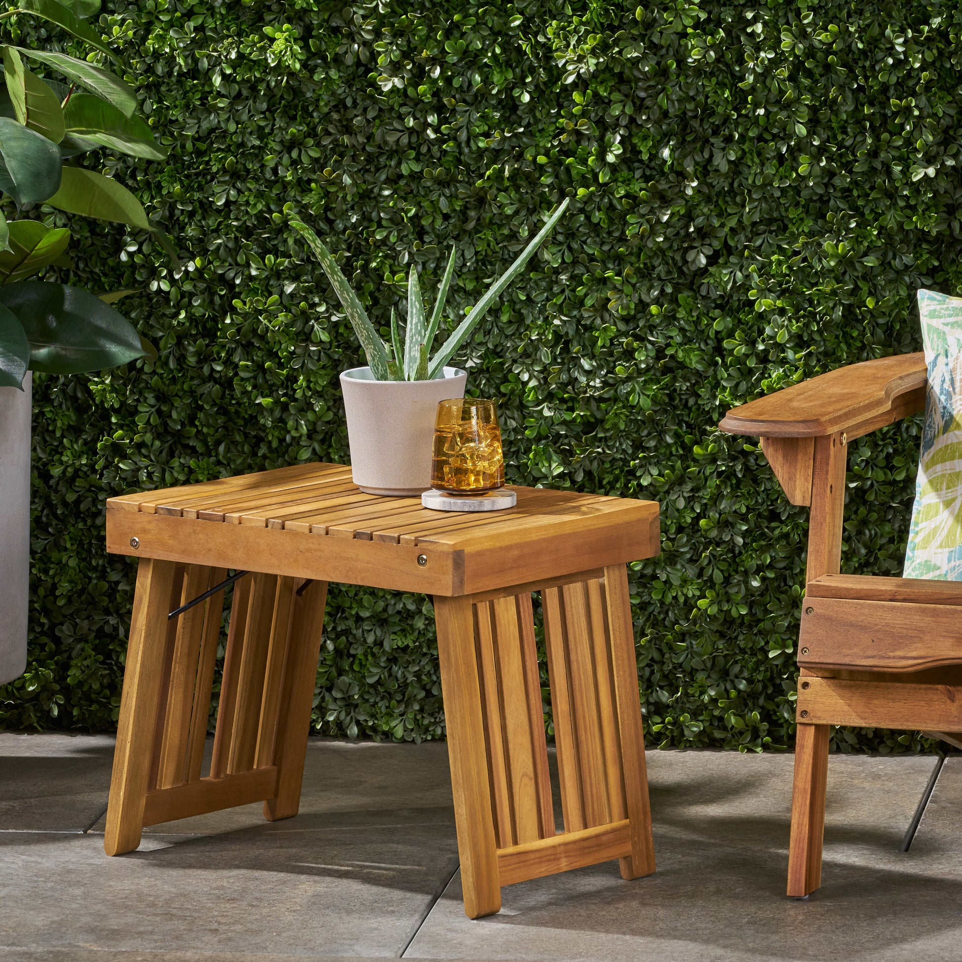 Natural wood slatted end table with minimalist design perfect for outdoor patios