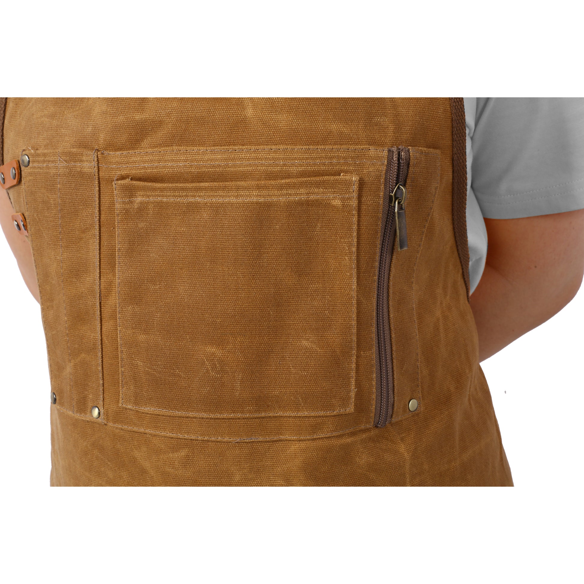 Brown canvas work apron with a large pocket and zippered pocket on the side