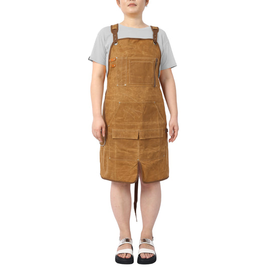 Brown canvas utility apron with multiple pockets and adjustable straps