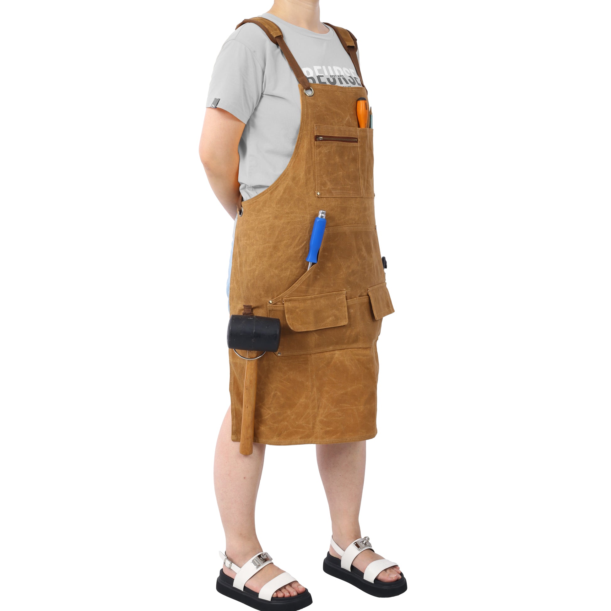 Brown canvas utility apron with multiple pockets and tool loops