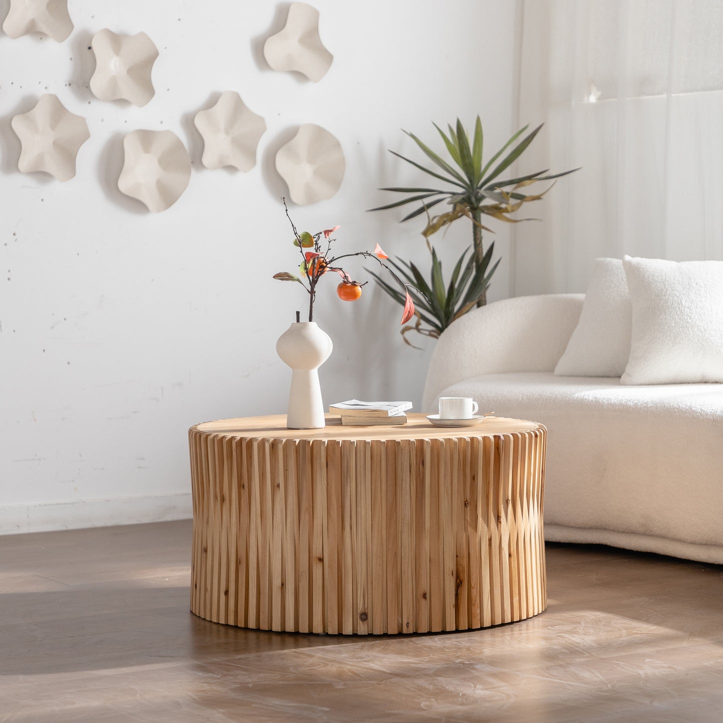 Round wooden coffee table with fluted design perfect for living room decor