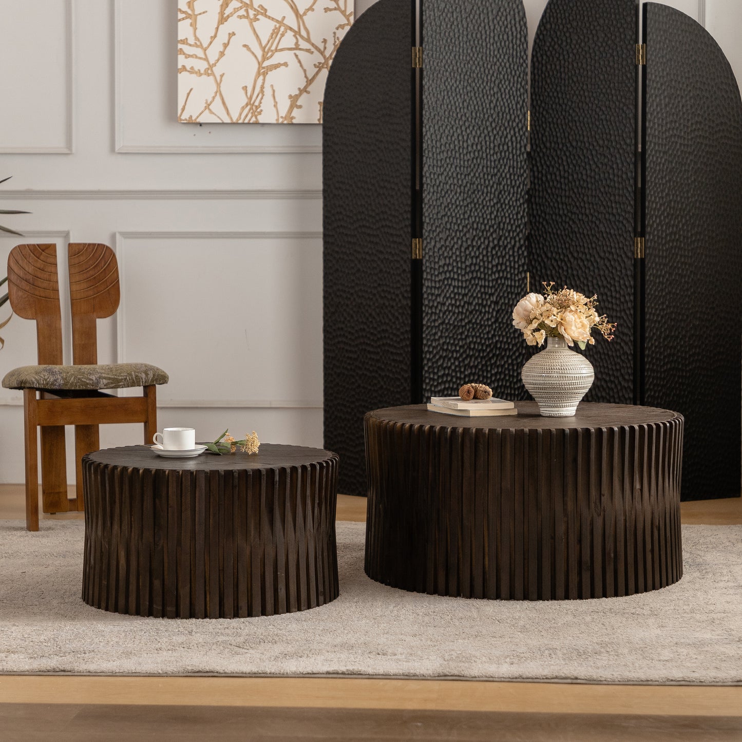 Dark wood ribbed coffee table with a white teacup and saucer on top